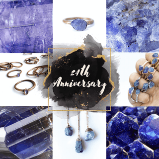Raw tanzanite gemstones and sterling silver jewelry pieces including rings, necklaces and bracelets with blue-violet tones